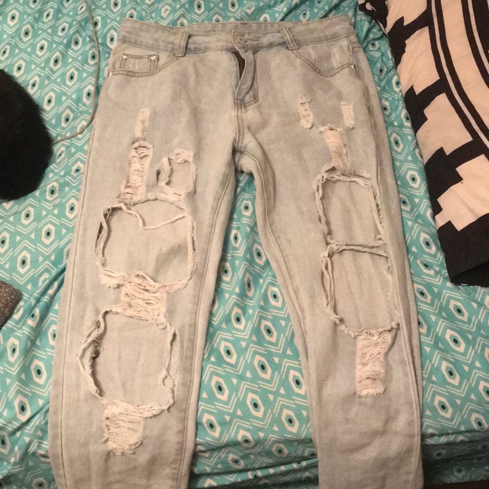 Large straight legged ripped jeans